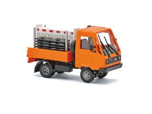 Multicar M26 oranžový s naloženými zátarasy Busch 42254